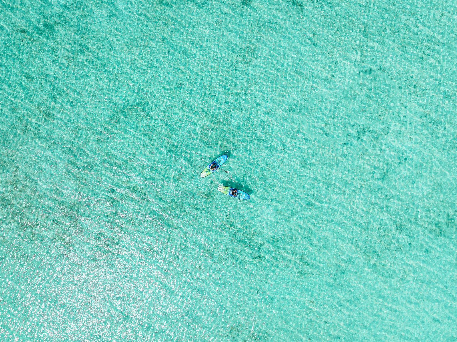 SUP-бординг на курорте One&Only Reethi Rah SUP-бординг на мальдивском курорте One&Only Reethi Rah